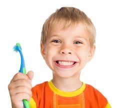 Child holding a toothbrush